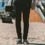 person holding shoulder-mount camcorder