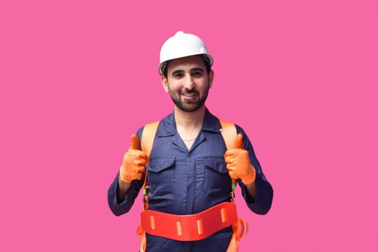 a person wearing a hard hat and holding a yellow tool