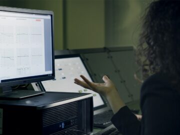 person using computer on table