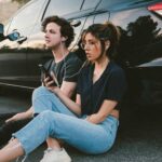 man and woman beside vehicle