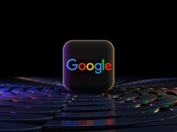 a close up of a computer keyboard with the word google on it