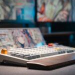 A computer keyboard sitting on top of a desk