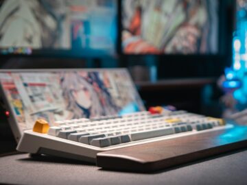 A computer keyboard sitting on top of a desk