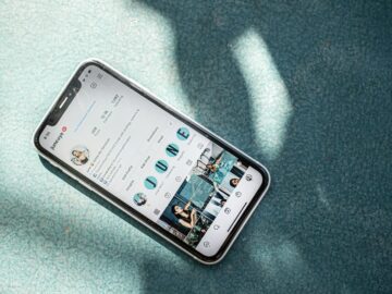white samsung android smartphone on teal textile