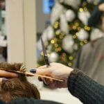 woman cutting man's hair
