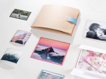 a white table topped with pictures and a book
