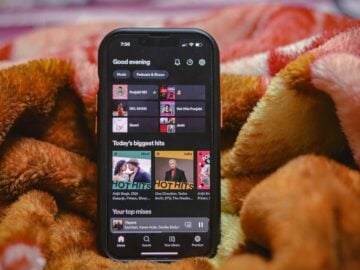 a close up of a cell phone on a blanket