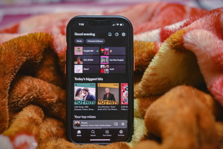 a close up of a cell phone on a blanket