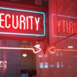 a red security sign and a blue security sign