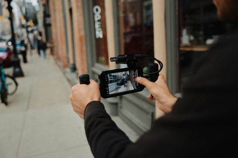 A man holding a camera up to take a picture