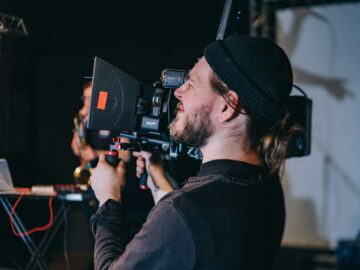 man holding video camera