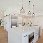 turned on pendant lamps above kitchen island