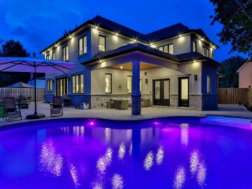 white concrete building near swimming pool during night time