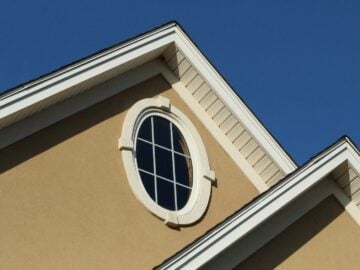 brown concrete building with white window