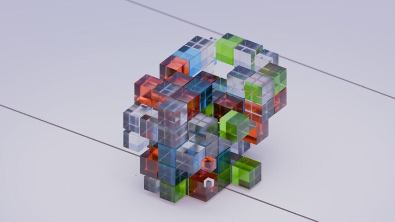 A colorful cube is shown on a white surface