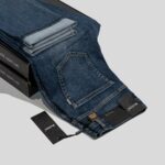 a pair of jeans sitting on top of a box
