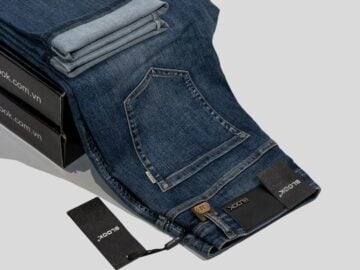 a pair of jeans sitting on top of a box