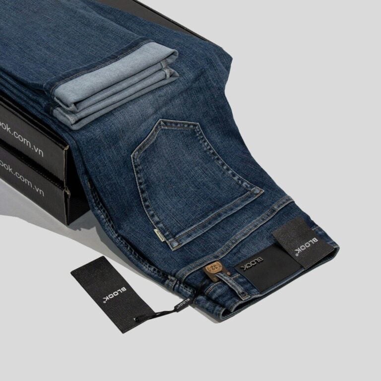 a pair of jeans sitting on top of a box