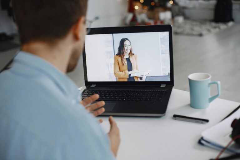 man and woman video business meeting