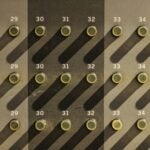 A wall with a lot of circles and numbers on it