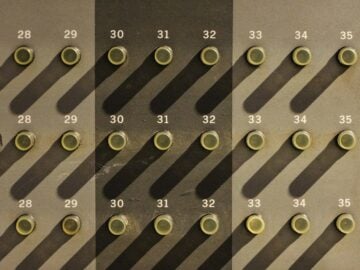 A wall with a lot of circles and numbers on it