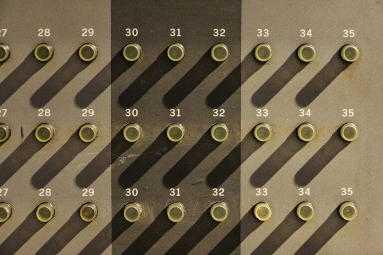 A wall with a lot of circles and numbers on it