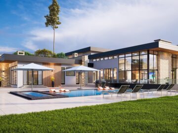 a modern house with a pool and lounge chairs