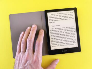 A person is reading a book on a tablet